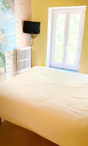 Katil atau katil-katil dalam bilik di Hotel Les Passions