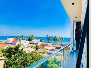 a view of the ocean from a balcony of a building at Quang Vinh - Đảo Lý Sơn in Ly Son