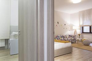 A bed or beds in a room at Genova XXV Aprile by Wonderful Italy