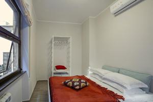 A bed or beds in a room at Genova XXV Aprile by Wonderful Italy