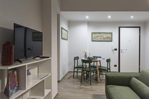 A television and/or entertainment centre at Genova XXV Aprile by Wonderful Italy