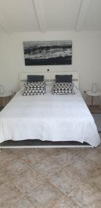 Giường trong phòng chung tại Rooms and Apartments V&M