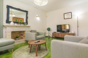 a living room with a fireplace and a tv at S'Olivaret -Alcudia- in Port d'Alcudia