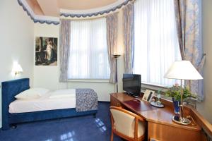 Postel nebo postele na pokoji v ubytování Hotel Viktoria