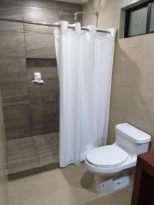 Koupelna v ubytování 9 Estrellas Casa Hotel