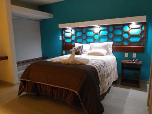 Postel nebo postele na pokoji v ubytování 9 Estrellas Casa Hotel