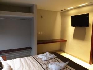 Postel nebo postele na pokoji v ubytování 9 Estrellas Casa Hotel