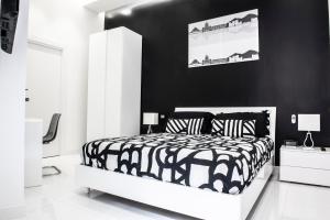 Ένα ή περισσότερα κρεβάτια σε δωμάτιο στο Rettifilo 201 Exclusive Rooms