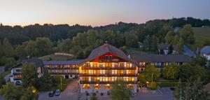 an aerial view of a hotel at dusk at Wellnesshotel Zum Koch in Ortenburg