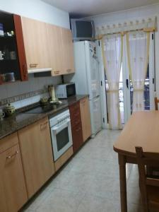 Kuchyň nebo kuchyňský kout v ubytování Apartamento Rio Gueña