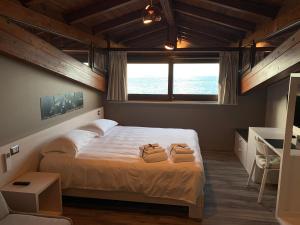 Ліжко або ліжка в номері Il Casato Deluxe Rooms