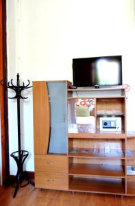 Uma TV ou centro de entretenimento em Lima Wari Hotel Boutique
