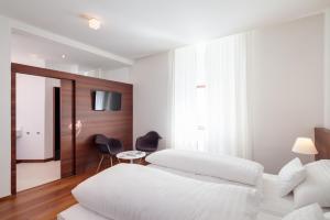Postel nebo postele na pokoji v ubytování Hotel Central