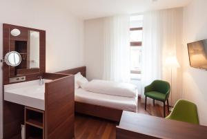 Postel nebo postele na pokoji v ubytování Hotel Central
