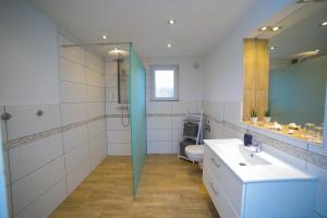a bathroom with a sink and a toilet at Apartment Claudia in Sinsheim +79 photos