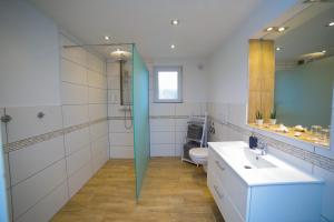 a bathroom with a sink and a toilet at Apartment Claudia in Sinsheim