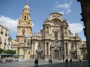 a large building with people walking in front of it at Nuevo junto a Catedral in Murcia