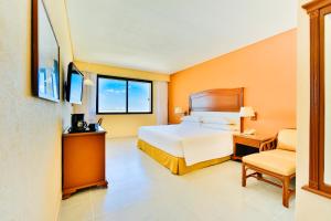 Voodi või voodid majutusasutuse Occidental Tucancún - All Inclusive toas