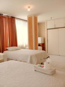 Voodi või voodid majutusasutuse HOTEL MAISON FIORI (Centro) toas