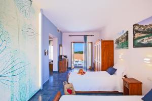 Posteľ alebo postele v izbe v ubytovaní Suvaki Resort