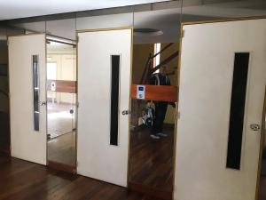 a man standing in a room with two doors at Bernardita in Ramos Mejía +16 photos