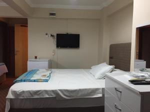 Postel nebo postele na pokoji v ubytování Paris Hotel