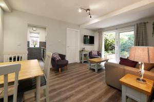 a living room with a couch and a table at Crewe Short Lets 4 Victoria Court, Crewe in Crewe