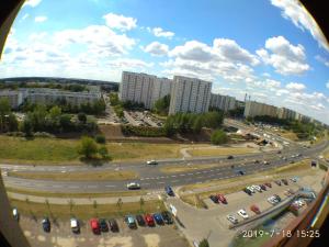 a view of a city with cars in a parking lot at 1050 Śmiałego 36 - Tanie Pokoje - samodzielne zameldowanie - self check in in Poznań