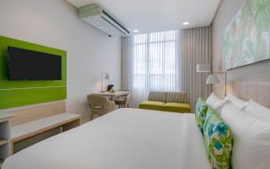 Mia Hotel Choco客房内的一张或多张床位