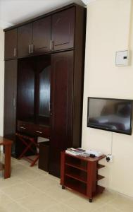 TV a/nebo společenská místnost v ubytování Al BARAKAH HOTEL