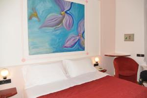 Posteľ alebo postele v izbe v ubytovaní Hotel Giotto