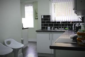 a kitchen with a sink and a toilet in it at Spacious Double Room in Anfield in Liverpool