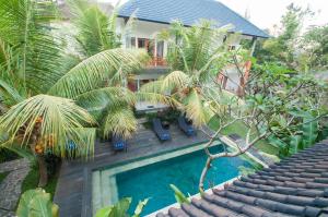 Bazén v ubytování Flamboyant Villa Ubud nebo v jeho okolí