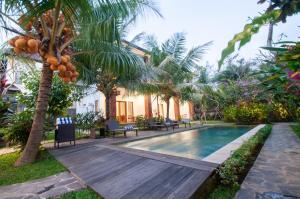 Bazén v ubytování Flamboyant Villa Ubud nebo v jeho okolí