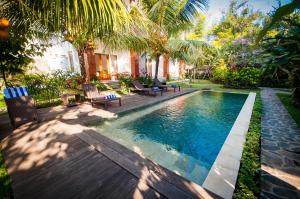 Bazén v ubytování Flamboyant Villa Ubud nebo v jeho okolí