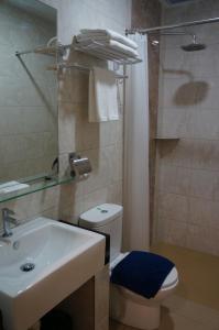 a bathroom with a sink and a toilet and a shower at LABUAN JATI HOTEL in Labuan