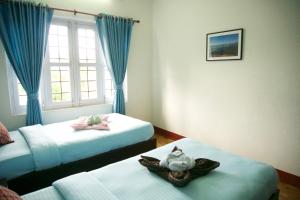 Katil atau katil-katil dalam bilik di Hope Guest House