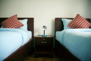 Katil atau katil-katil dalam bilik di Hope Guest House