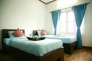 Katil atau katil-katil dalam bilik di Hope Guest House