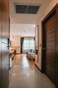 Postel nebo postele na pokoji v ubytování iCheck inn Central Patong