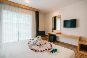 Postel nebo postele na pokoji v ubytování iCheck inn Central Patong