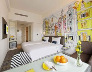 Letto o letti in una camera di YELLO Hotel Harmoni