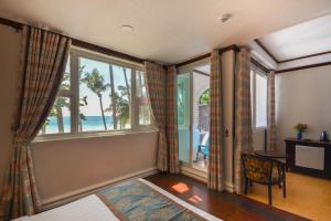 Postel nebo postele na pokoji v ubytování Royal Park Resort Boracay