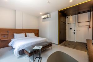 Postel nebo postele na pokoji v ubytování Reno hotel