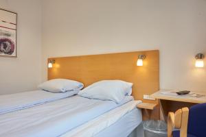 Postel nebo postele na pokoji v ubytování BB-Hotel Vejle Park