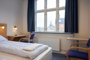 Postel nebo postele na pokoji v ubytování BB-Hotel Vejle Park
