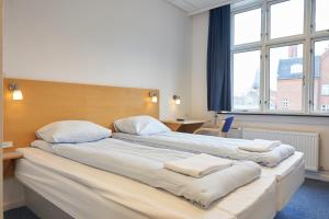 Postel nebo postele na pokoji v ubytování BB-Hotel Vejle Park