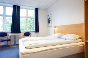 Postel nebo postele na pokoji v ubytování BB-Hotel Vejle Park