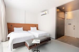 Postel nebo postele na pokoji v ubytování Reno hotel