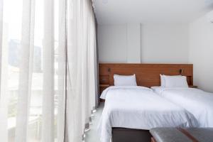 Postel nebo postele na pokoji v ubytování Reno hotel